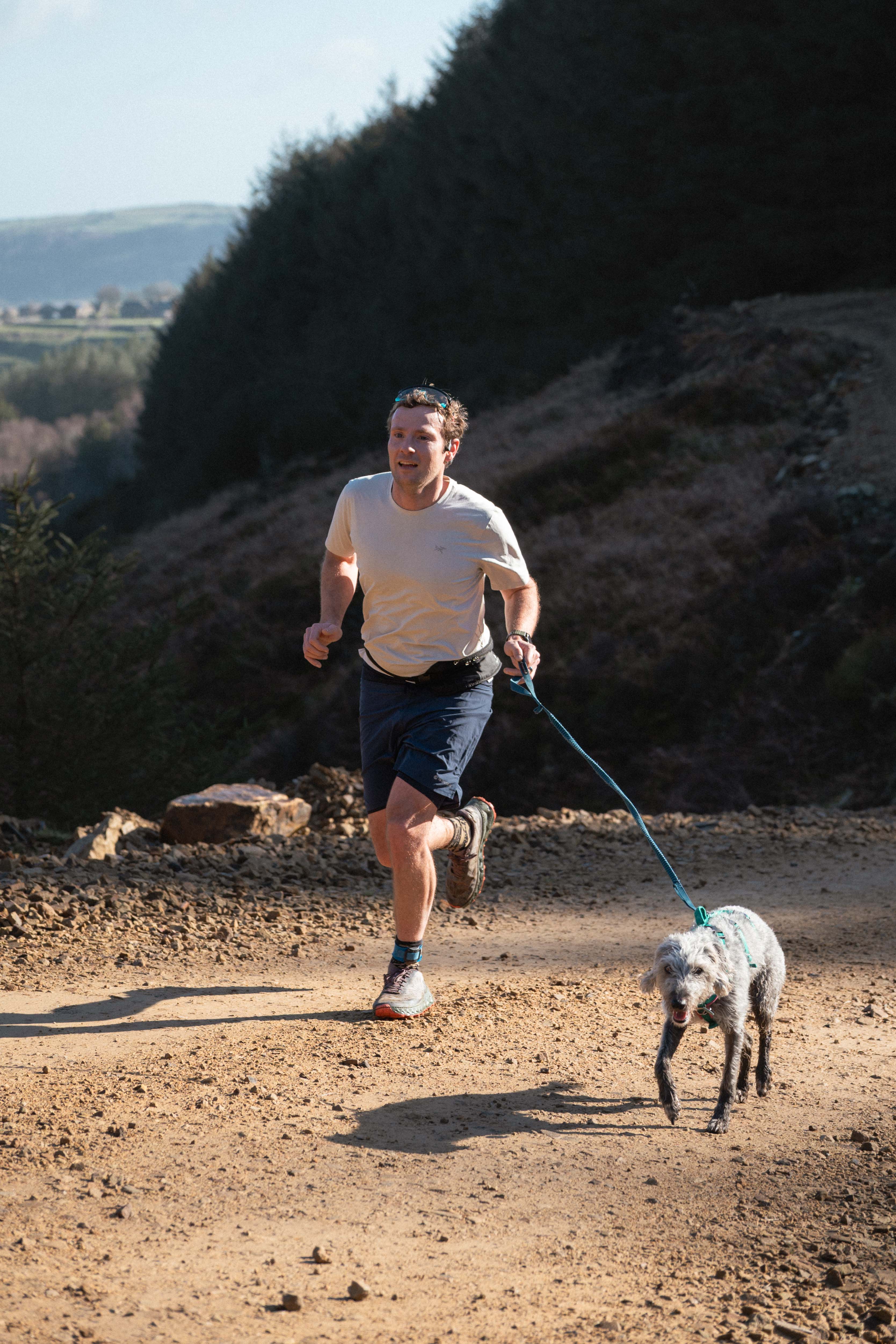 Running the trail course with the dog leading the way